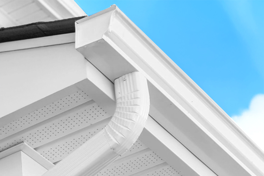 Seamless white aluminum downspout in Houston