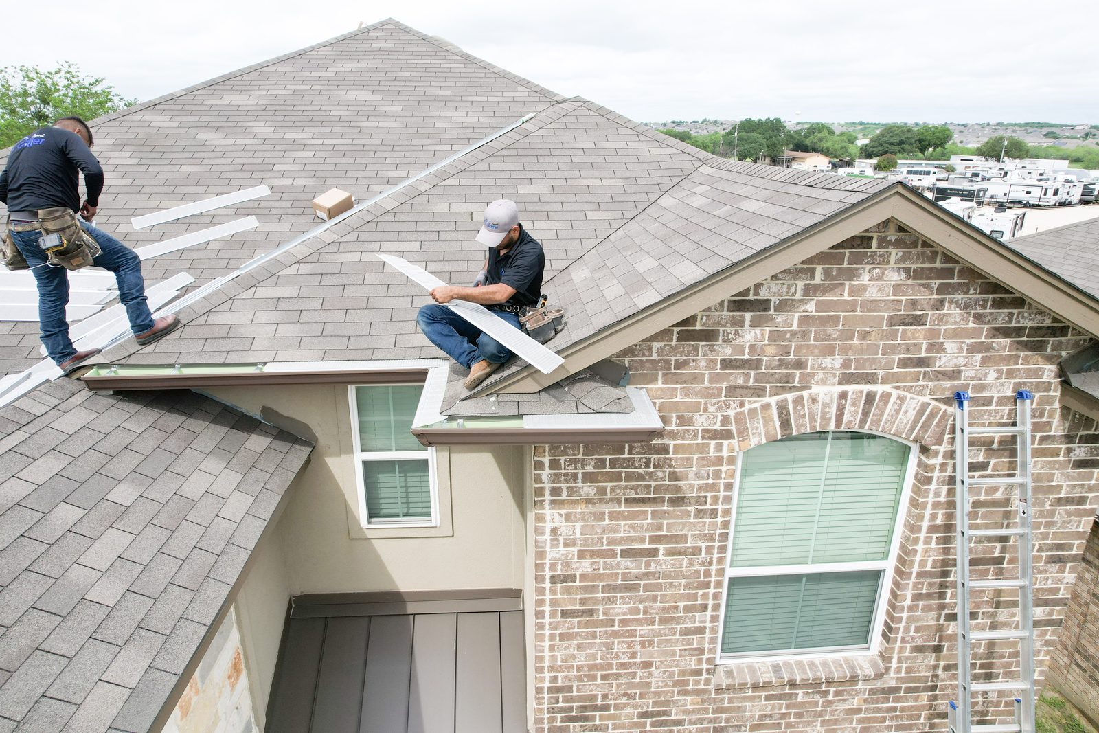 Gutter guard installation on a brick home roof in San Antonio - TX